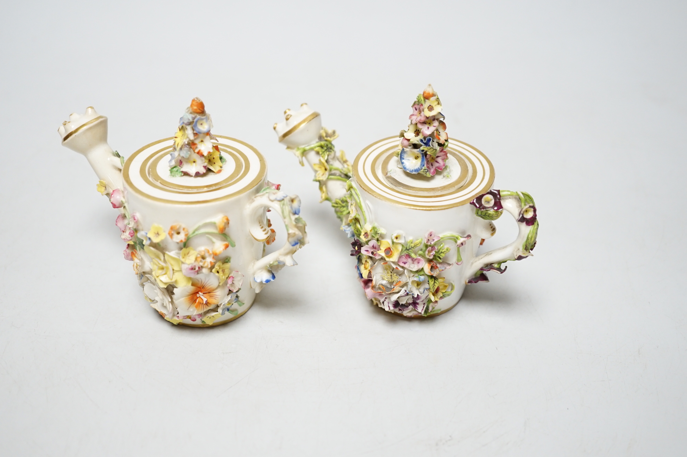 Two Derby porcelain floral encrusted miniature water sprinklers, circa 1825, 9cm high